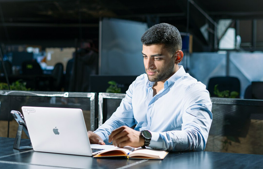 person using laptop in office