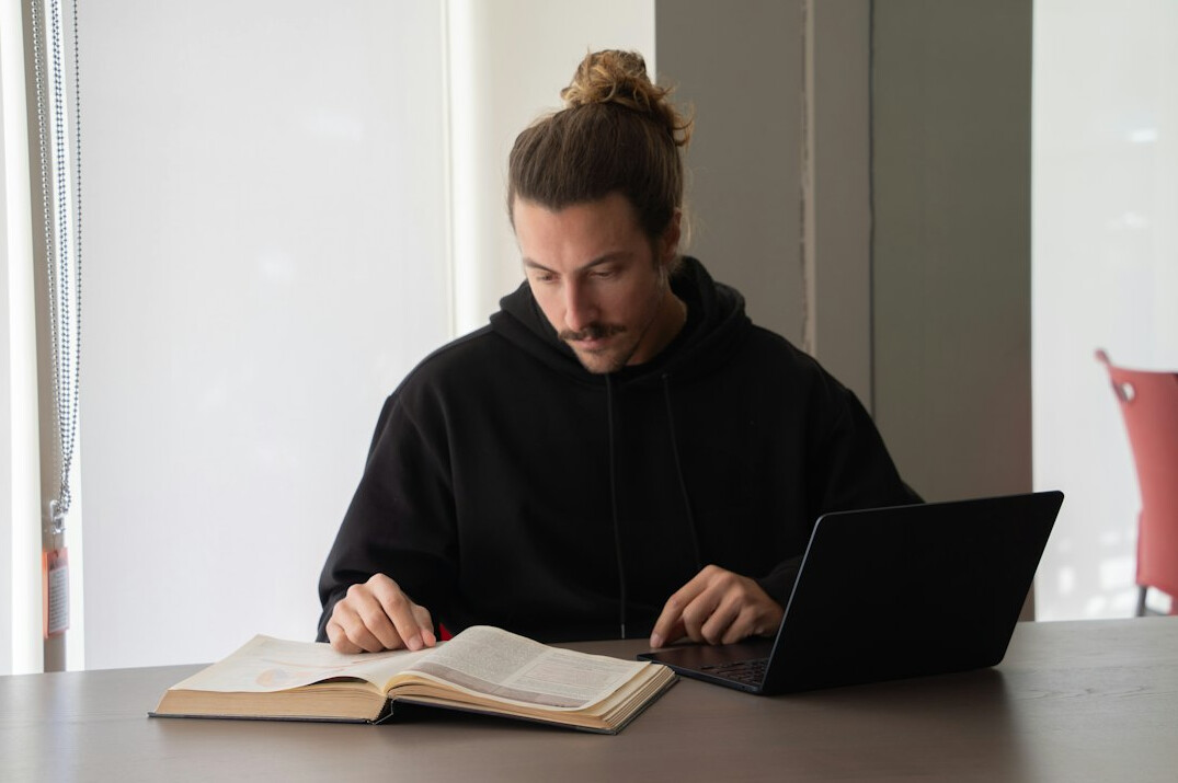 young person studying with laptop